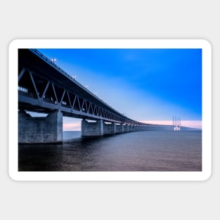 In the colorful evening light lies the Öresund Bridge, which connects Sweden and Denmark Sticker